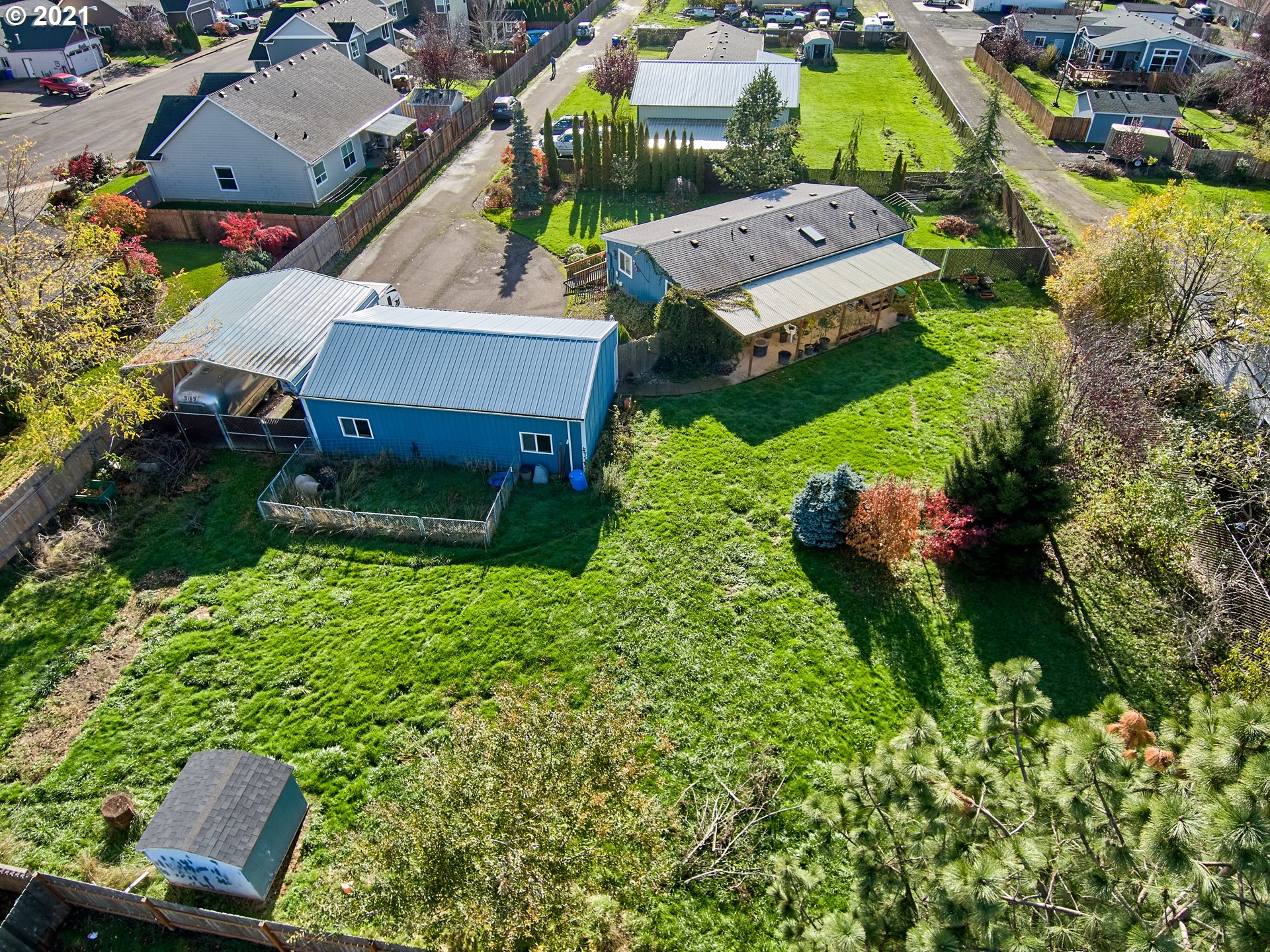 913 Toliver Road, Unit B Molalla, OR 97038 - Photo 23 of 26 an aerial view of a house with garden space and street view