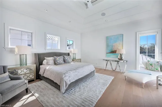 a bedroom with a large bed and a couch