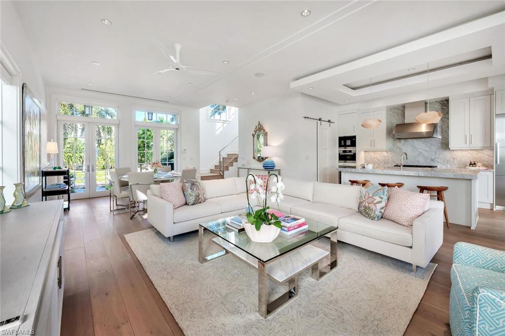 982 9th Avenue South Naples, FL 34102 - Photo 2 of 48 a living room with furniture and a large window