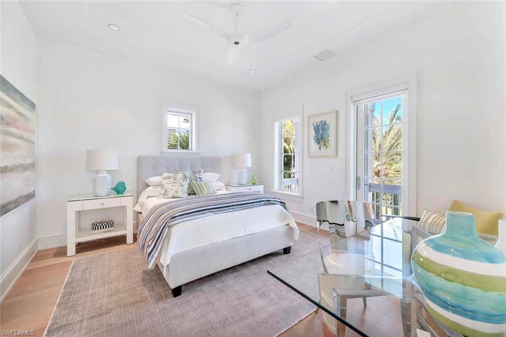 982 9th Avenue South Naples, FL 34102 - Photo 22 of 48 a bedroom with a bed and a couch
