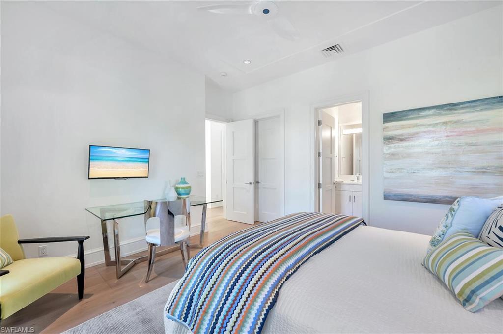 982 9th Avenue South Naples, FL 34102 - Photo 23 of 48 a bedroom with a bed and a couch