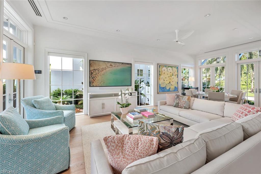 982 9th Avenue South Naples, FL 34102 - Photo 4 of 48 a living room with furniture and a flat screen tv