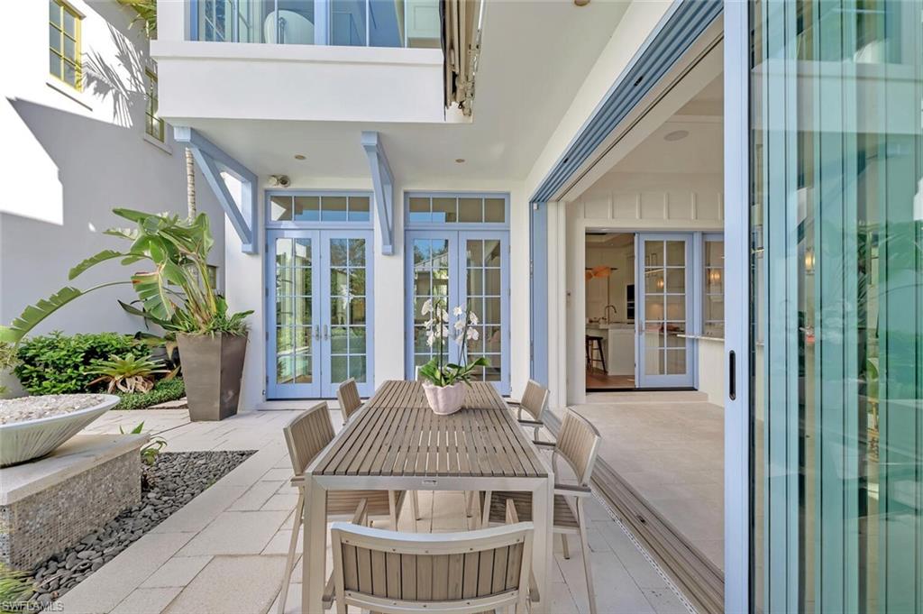 982 9th Avenue South Naples, FL 34102 - Photo 42 of 48 a view of balcony with furniture and garden