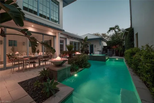 a view of swimming pool with outdoor seating