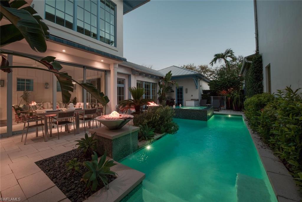 982 9th Avenue South Naples, FL 34102 - Photo 45 of 48 a view of a house with backyard porch and sitting area