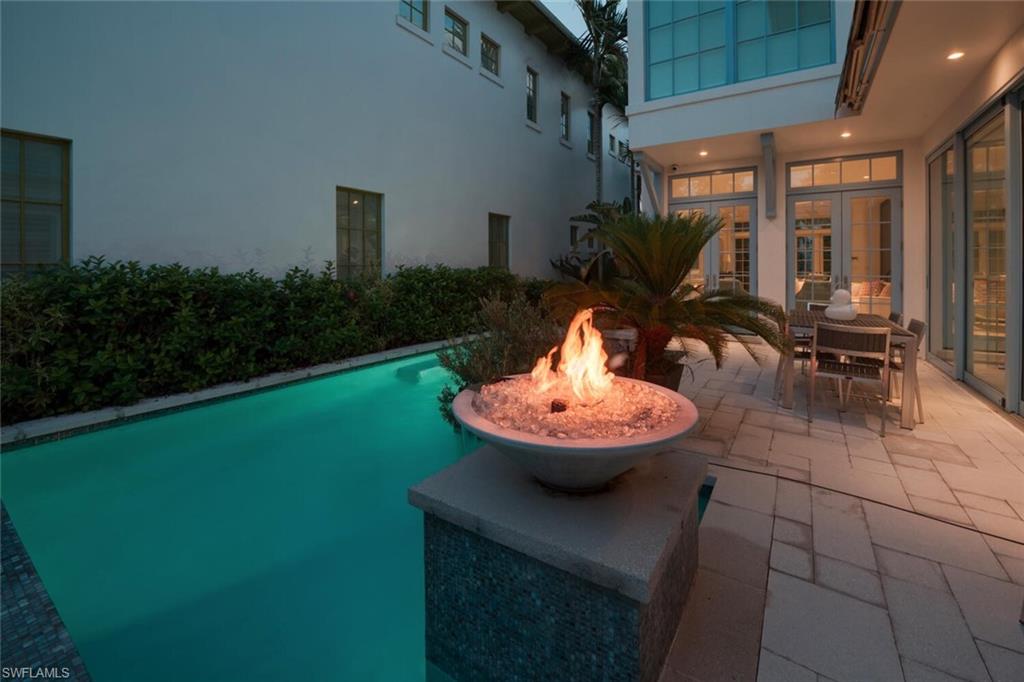 982 9th Avenue South Naples, FL 34102 - Photo 48 of 48 a view of a house with backyard sitting area and garden