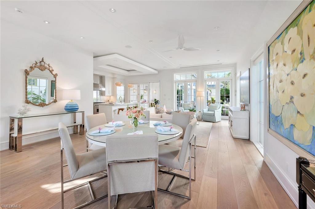 982 9th Avenue South Naples, FL 34102 - Photo 5 of 48 a view of a dining room with furniture and wooden floor