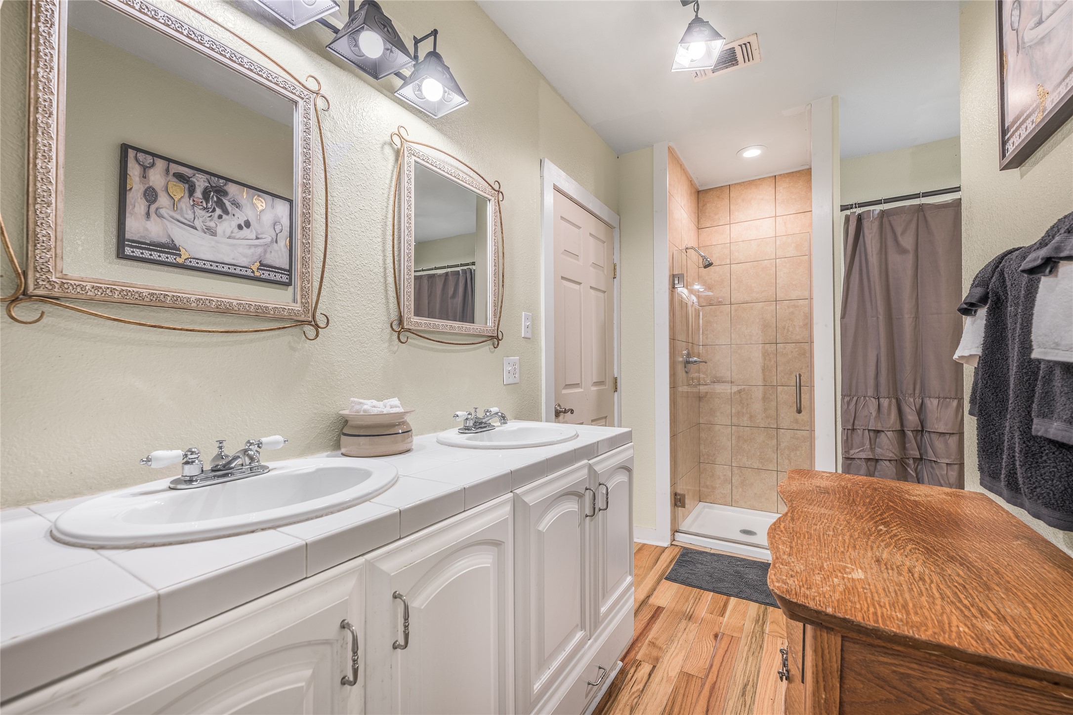 4310 Leslie Road Fayetteville, TX 78940 - Photo 13 of 22 a bathroom with a sink double vanity granite tub shower and a mirror