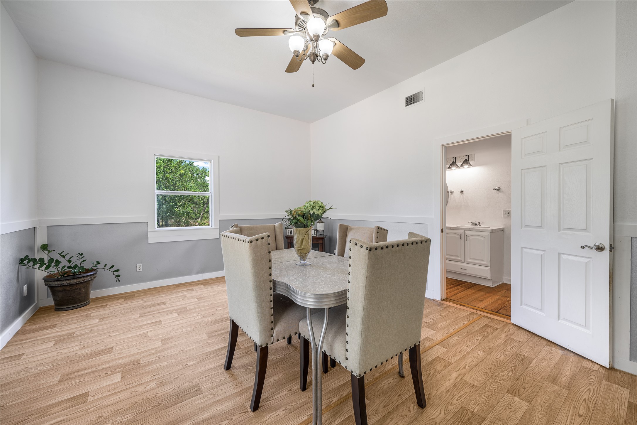 4310 Leslie Road Fayetteville, TX 78940 - Photo 14 of 22 a dining room with furniture a chandelier and wooden floor