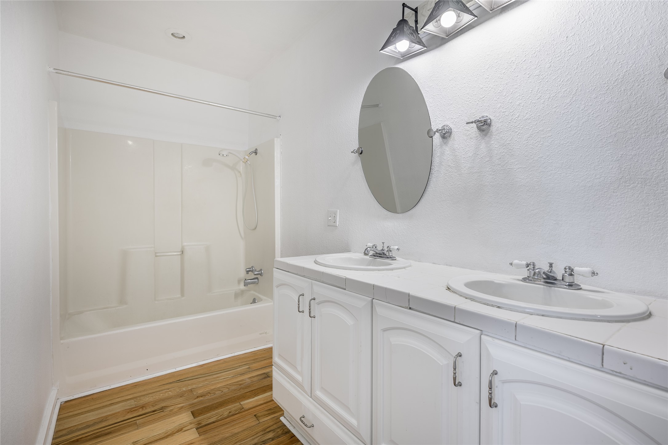 4310 Leslie Road Fayetteville, TX 78940 - Photo 15 of 22 a bathroom with a sink and a mirror