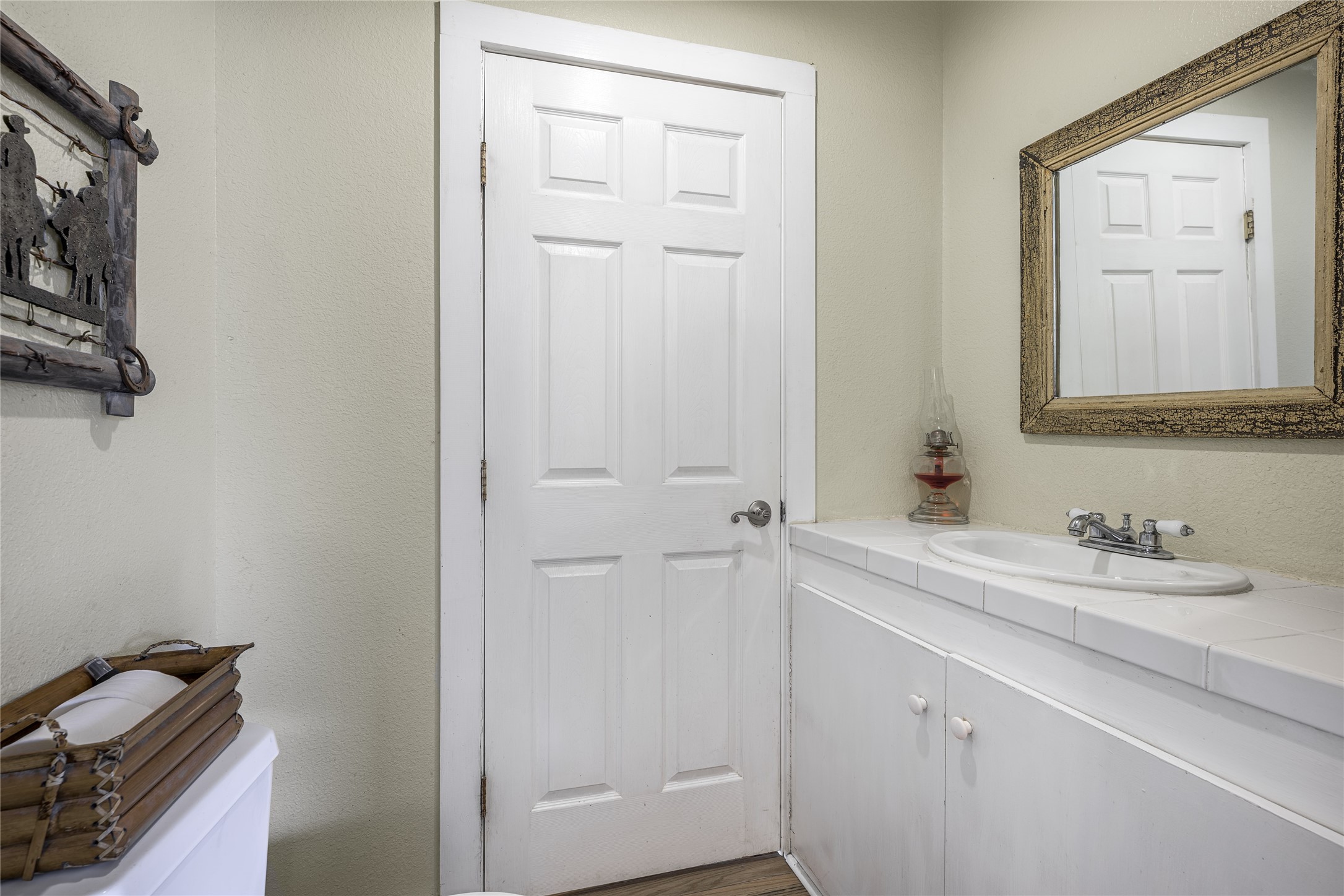 4310 Leslie Road Fayetteville, TX 78940 - Photo 16 of 22 a bathroom with a sink and a mirror