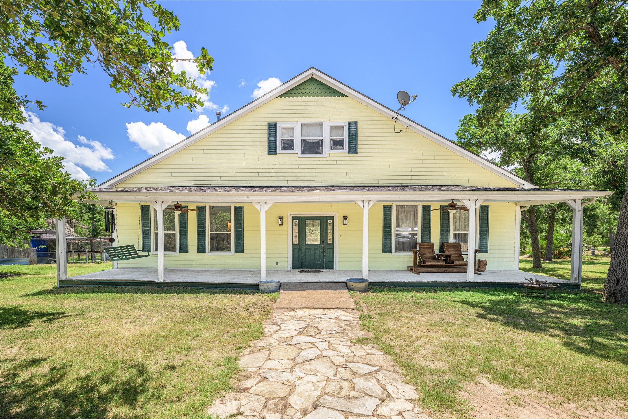 4310 Leslie Road Fayetteville, TX 78940 - Photo 2 of 22 a front view of a house with a yard