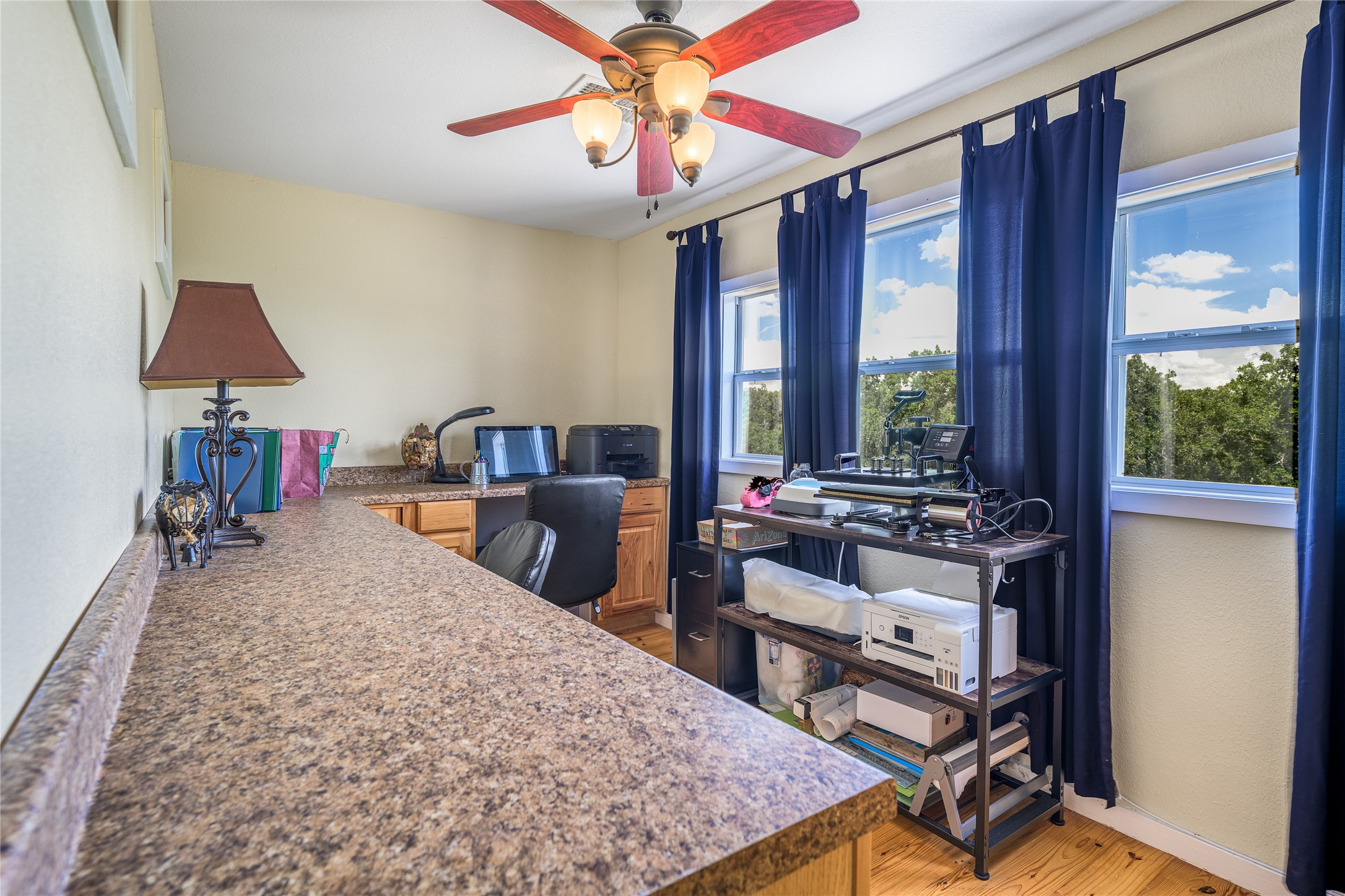 4310 Leslie Road Fayetteville, TX 78940 - Photo 21 of 22 a bed room with a bed and a chandelier