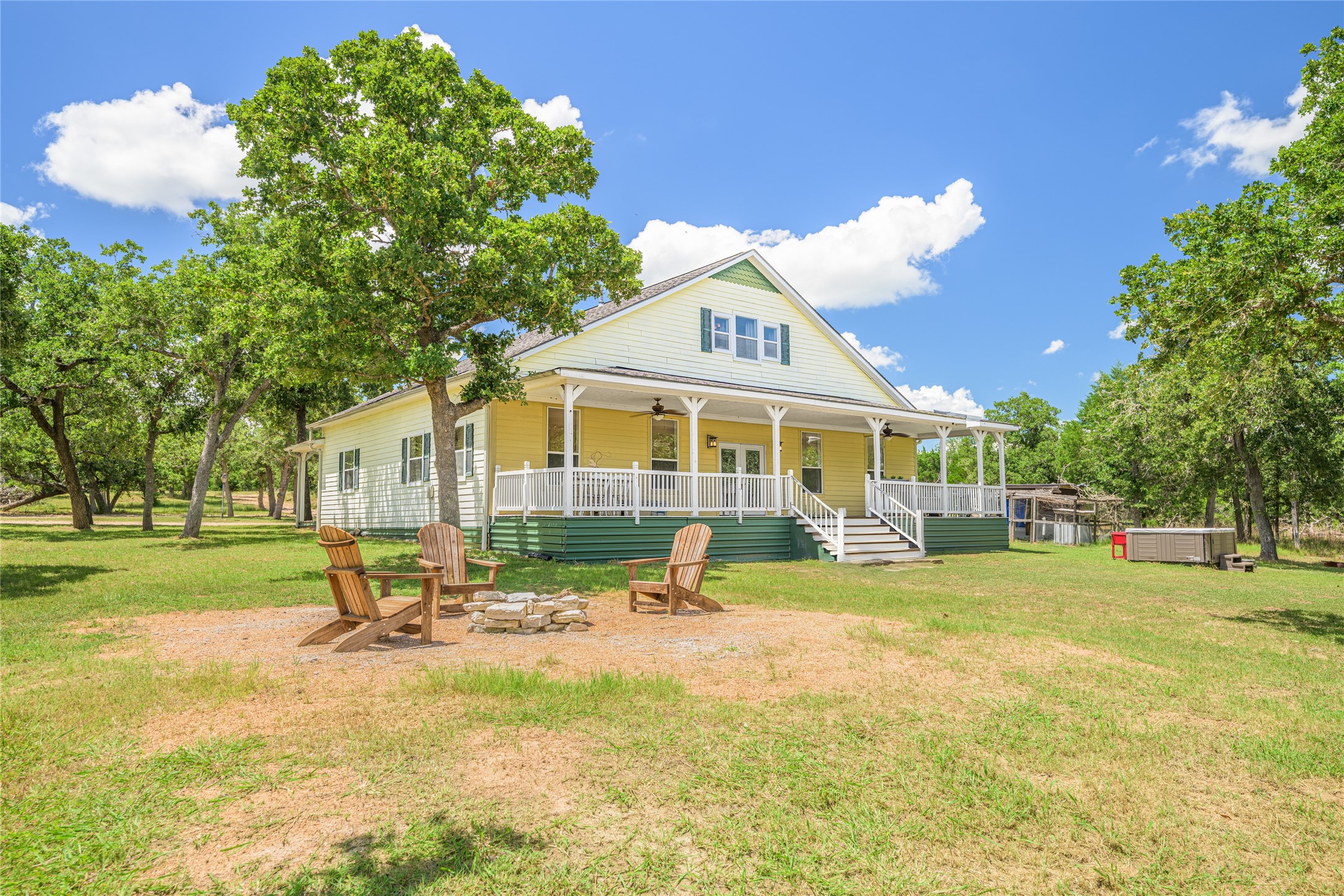 4310 Leslie Road Fayetteville, TX 78940 - Photo 3 of 22 a view of a house with swimming pool and sitting area