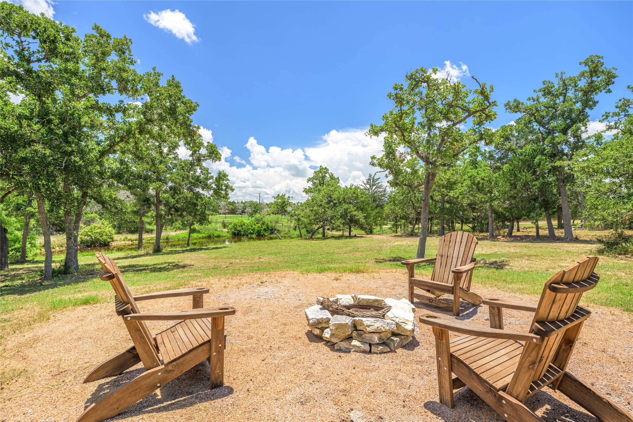 4310 Leslie Road Fayetteville, TX 78940 - Photo 4 of 22 a view of a swimming pool with lounge chairs