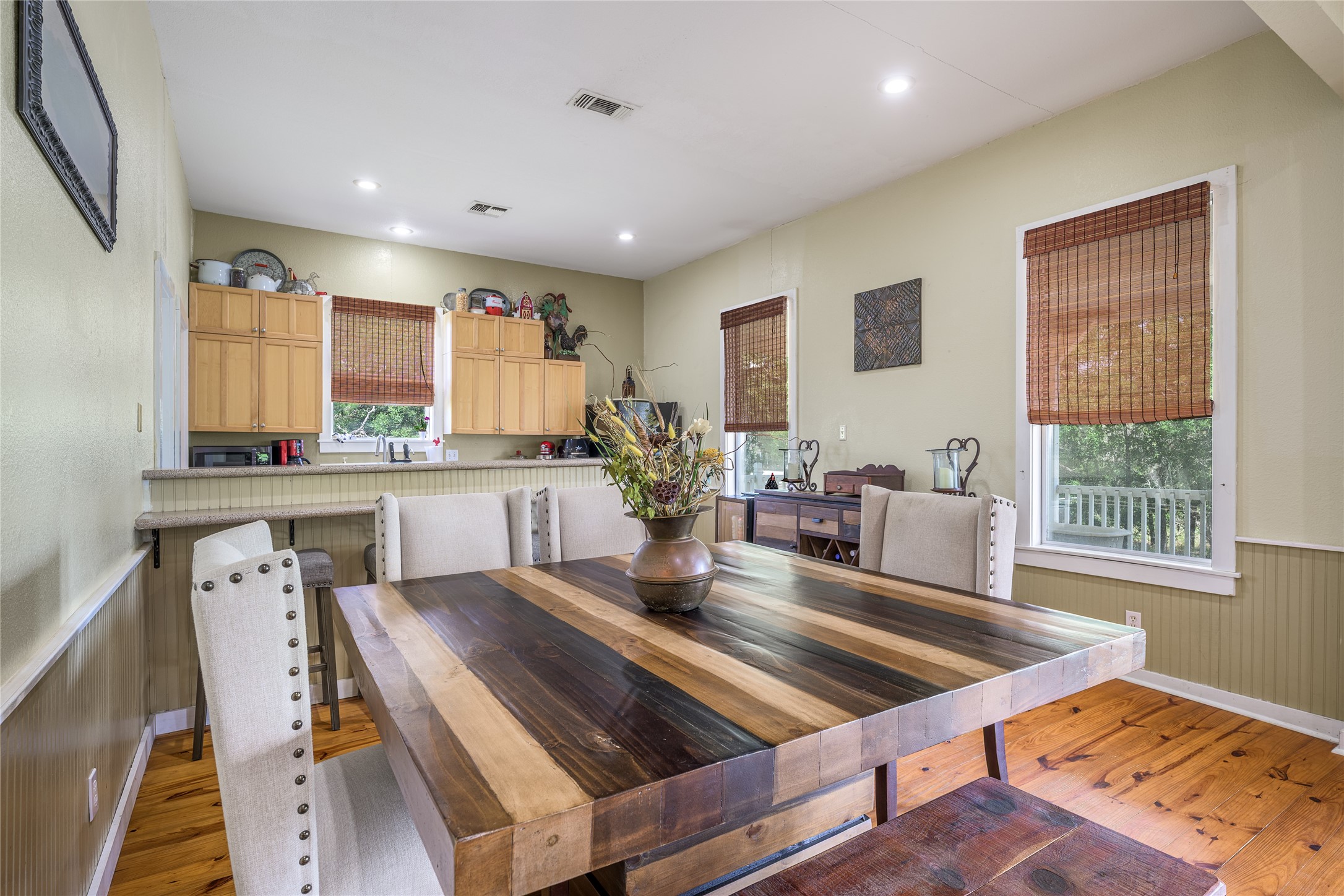 4310 Leslie Road Fayetteville, TX 78940 - Photo 6 of 22 a kitchen with kitchen island a appliances dining table and a large window
