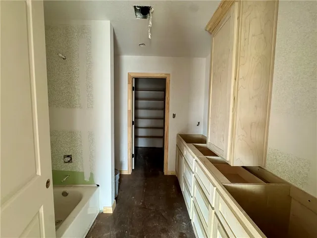 a view of a store room with wooden floor