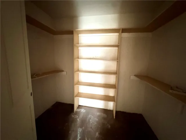 a hallway with wooden floor