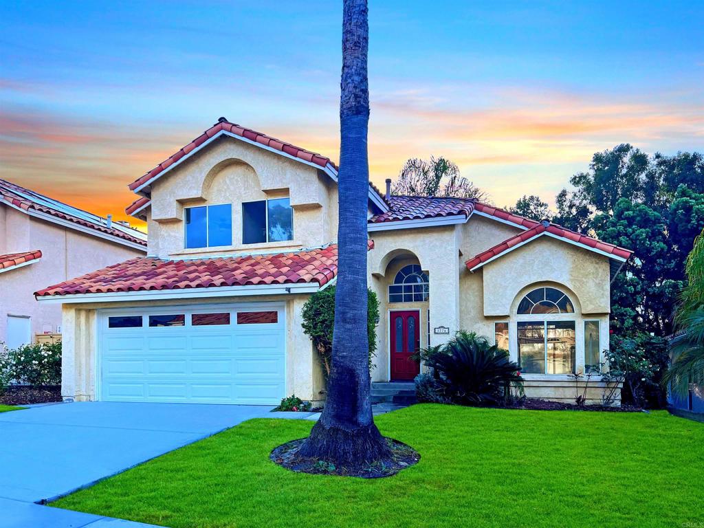 1776 Crystal Ridge Way Vista, CA 92081 - Photo 1 of 1 a front view of a house with a yard and garage