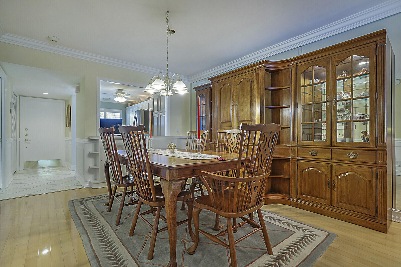 700 Harbour Drive, Unit 2310 Boca Raton, FL 33431 - Photo 14 of 40 a dining room with furniture a chandelier and wooden floor