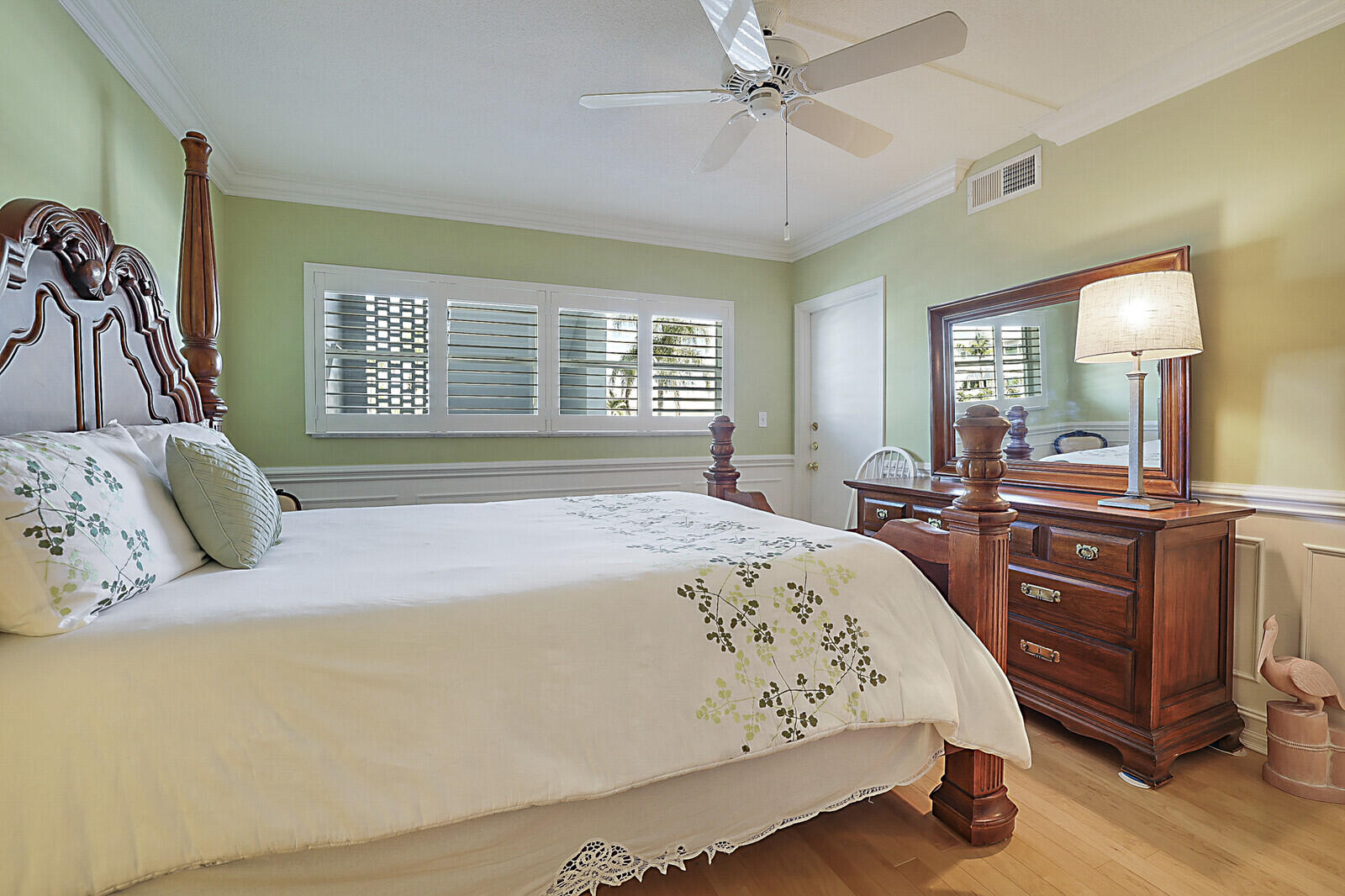 700 Harbour Drive, Unit 2310 Boca Raton, FL 33431 - Photo 25 of 40 a spacious bedroom with a large bed and a chandelier