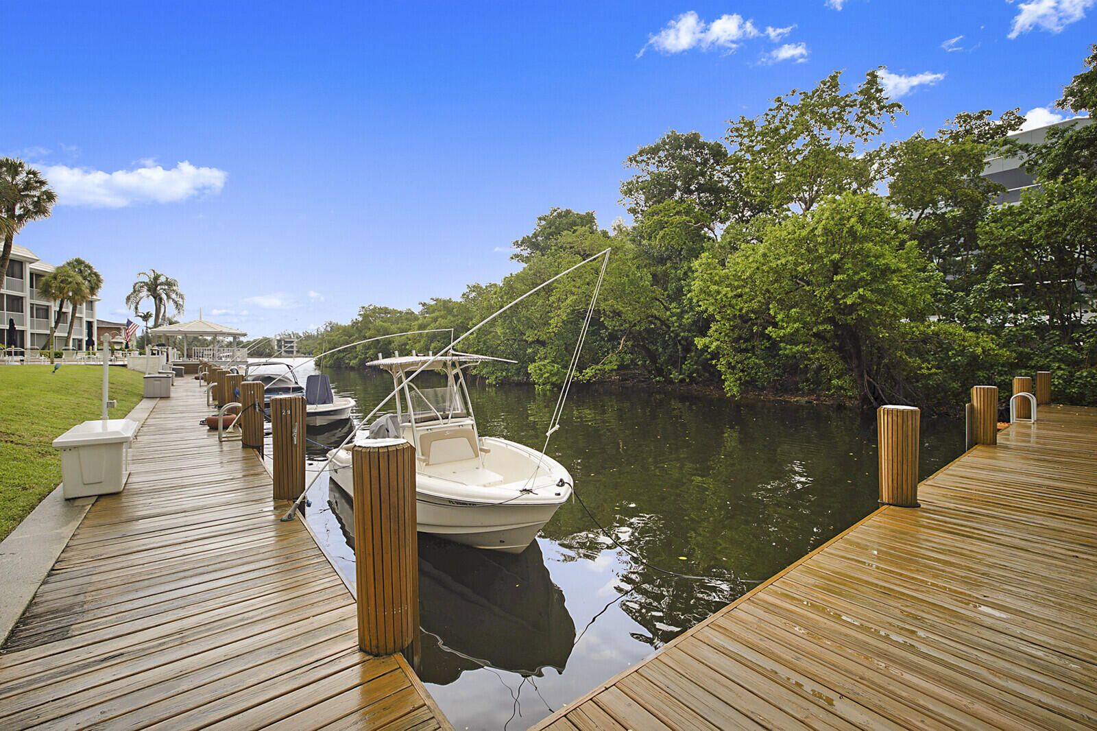 700 Harbour Drive, Unit 2310 Boca Raton, FL 33431 - Photo 30 of 40 a view of a lake with boats and trees in the background