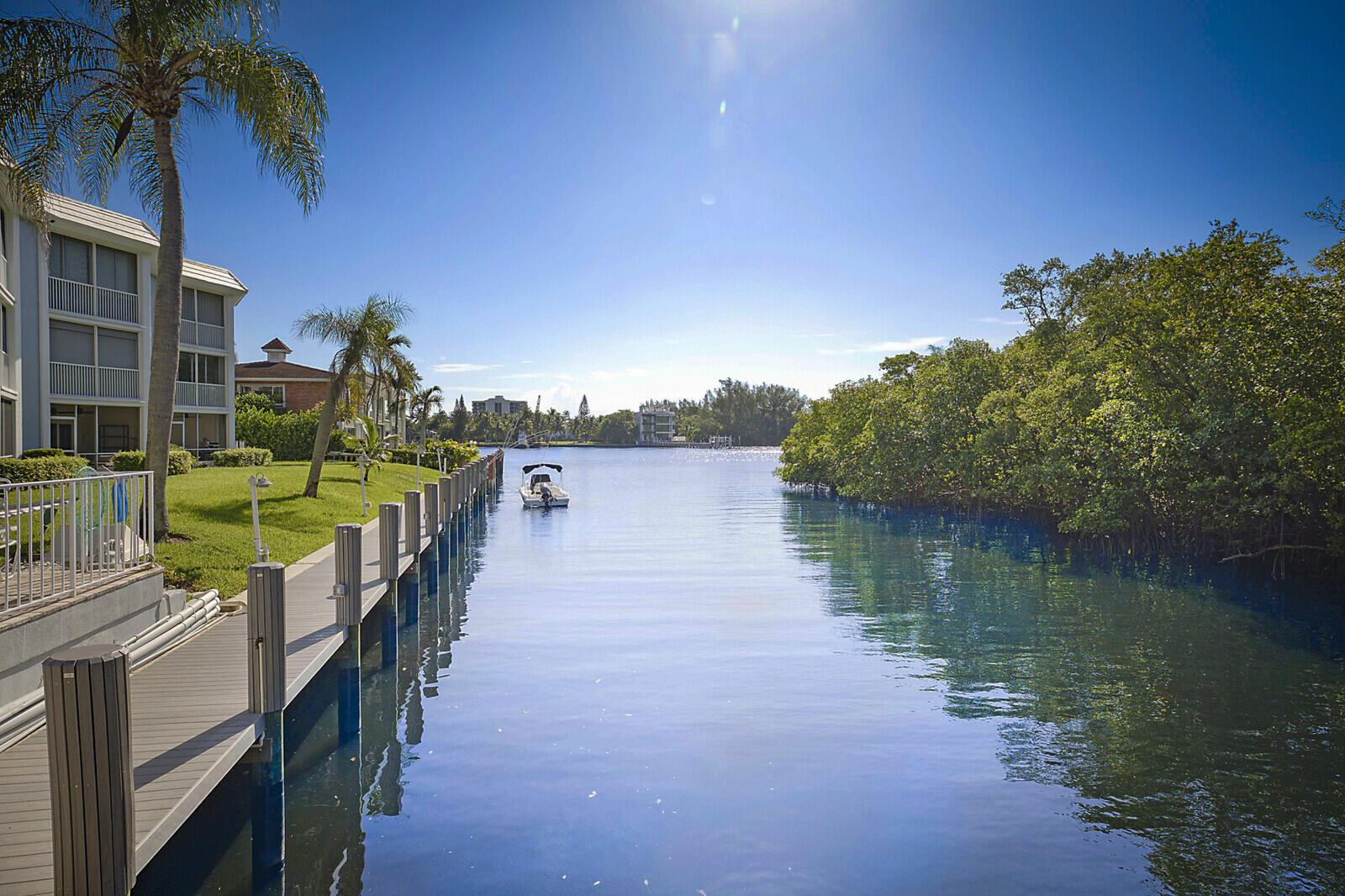 700 Harbour Drive, Unit 2310 Boca Raton, FL 33431 - Photo 34 of 40 a view of a lake with a building in the background