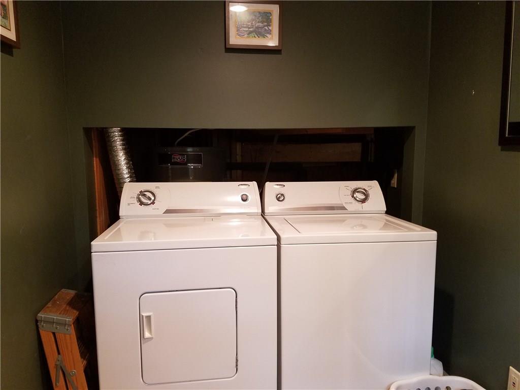 59 Goosepecker Ridge Road Freedom, ME 04941 - Photo 13 of 32 First floor laundry in the half bathroom