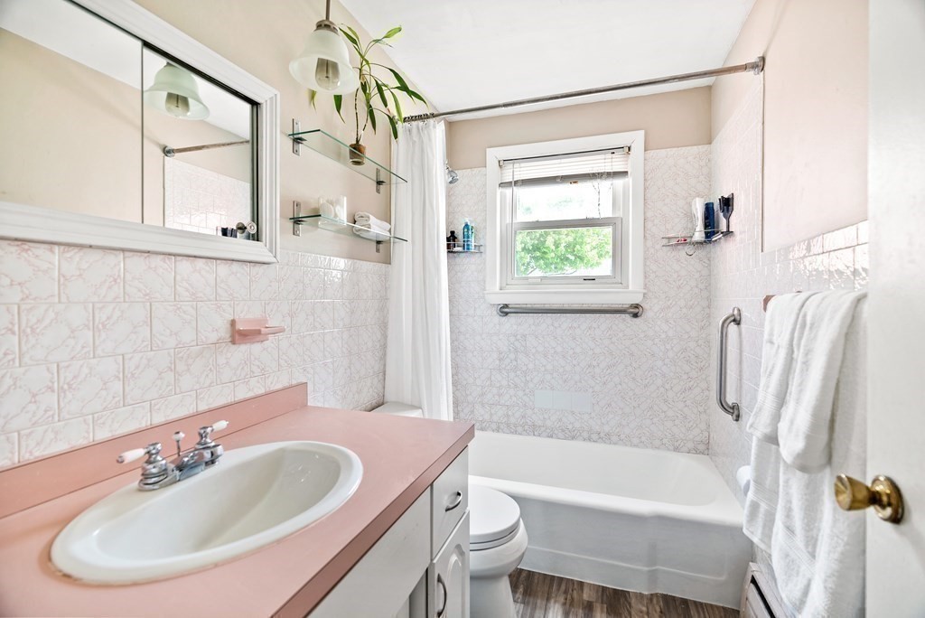15 Dow Road Boston, MA 02132 - Photo 17 of 40 a bathroom with a sink toilet and shower