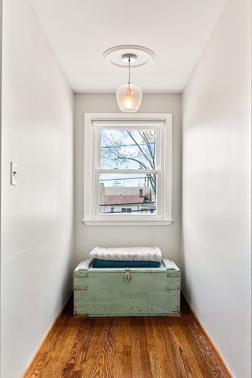 15 Dow Road Boston, MA 02132 - Photo 20 of 40 a room with a window and wooden floor