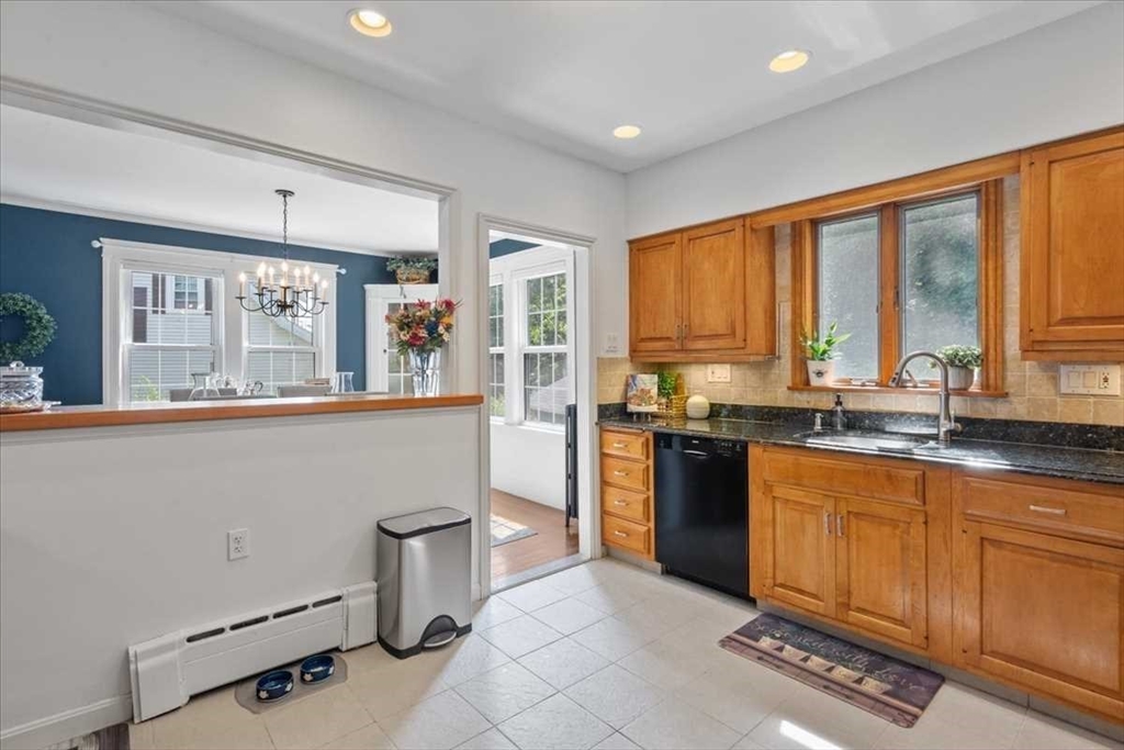 61 Havelock Road Worcester, MA 01602 - Photo 15 of 37 a kitchen with a sink window and cabinets