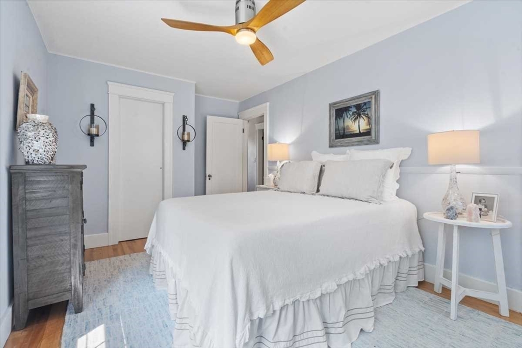 61 Havelock Road Worcester, MA 01602 - Photo 24 of 37 a bedroom with a bed and a lamp on dresser