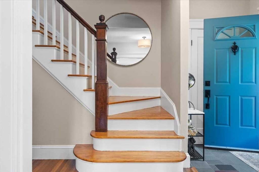 61 Havelock Road Worcester, MA 01602 - Photo 4 of 37 a view of staircase with wooden floor and a potted plant
