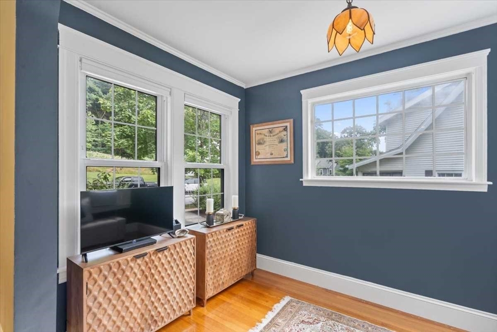 61 Havelock Road Worcester, MA 01602 - Photo 8 of 37 a living room with furniture and a flat screen tv
