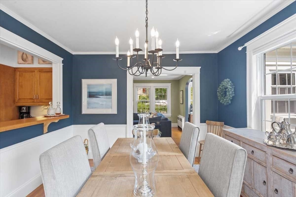 61 Havelock Road Worcester, MA 01602 - Photo 10 of 37 a living room with large couches chandelier and large windows