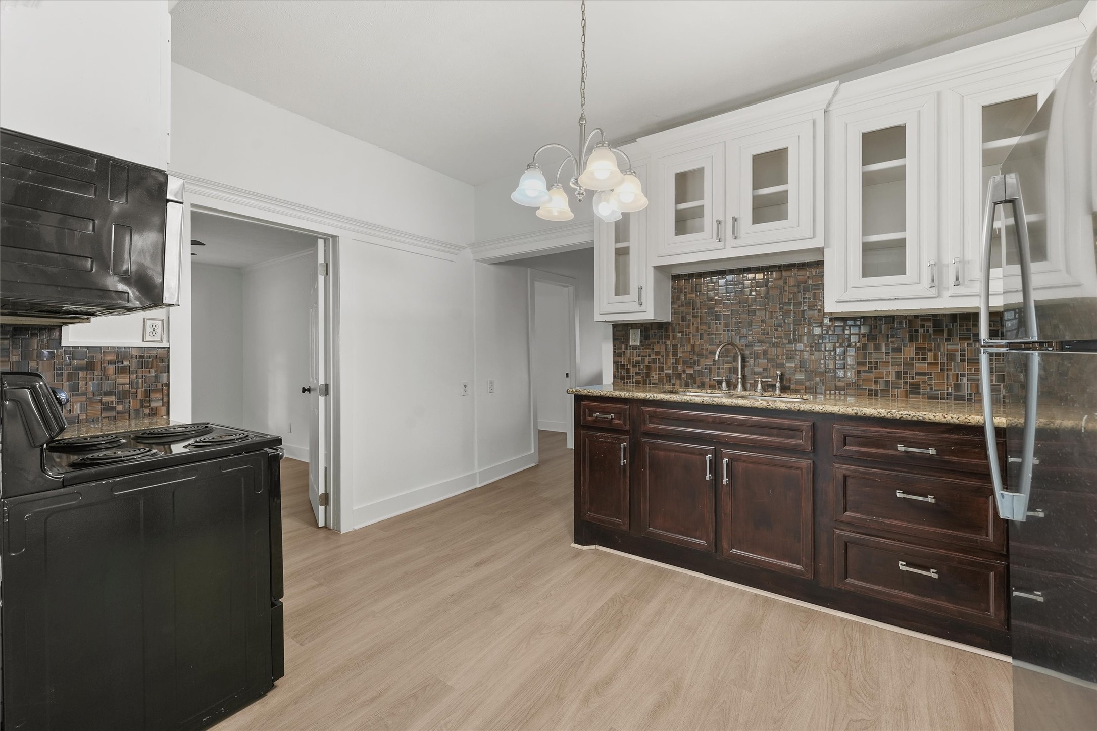4029 Lucille Street Houston, TX 77026 - Photo 6 of 28 a kitchen with stainless steel appliances granite countertop a sink and cabinets