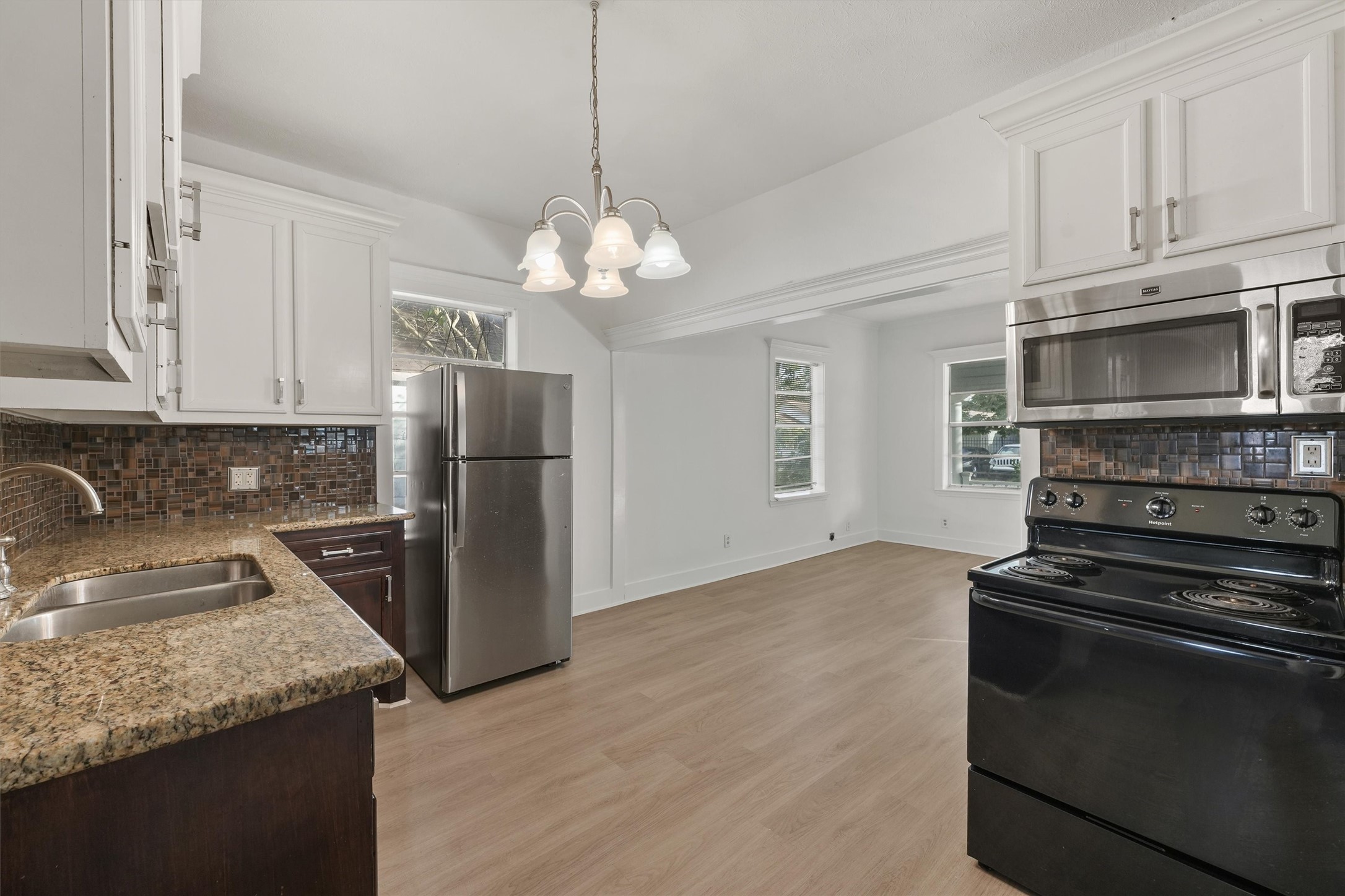 4029 Lucille Street Houston, TX 77026 - Photo 8 of 28 a kitchen with stainless steel appliances granite countertop a sink stove and refrigerator