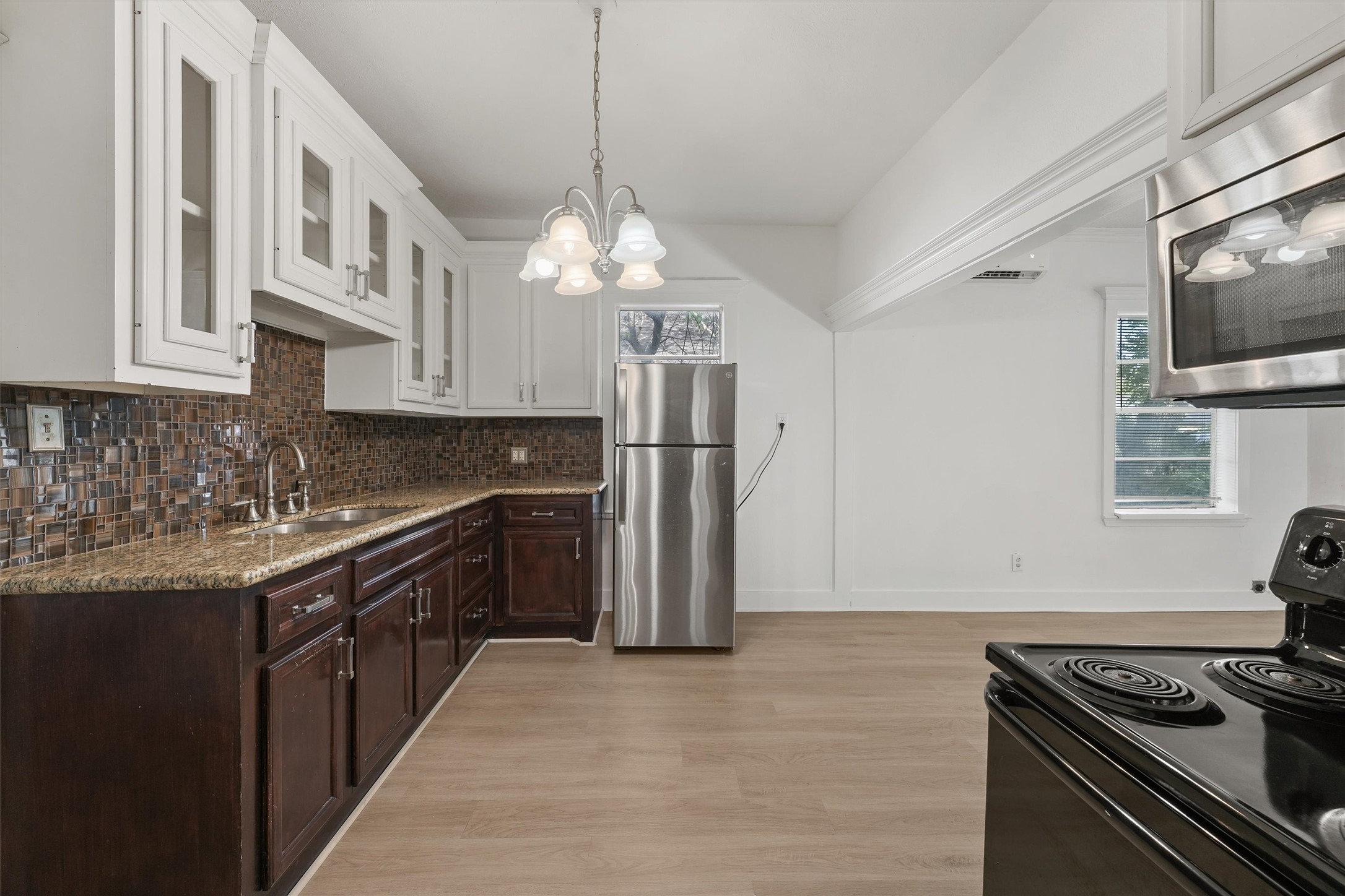 4029 Lucille Street Houston, TX 77026 - Photo 9 of 28 a kitchen with stainless steel appliances granite countertop a stove and a refrigerator