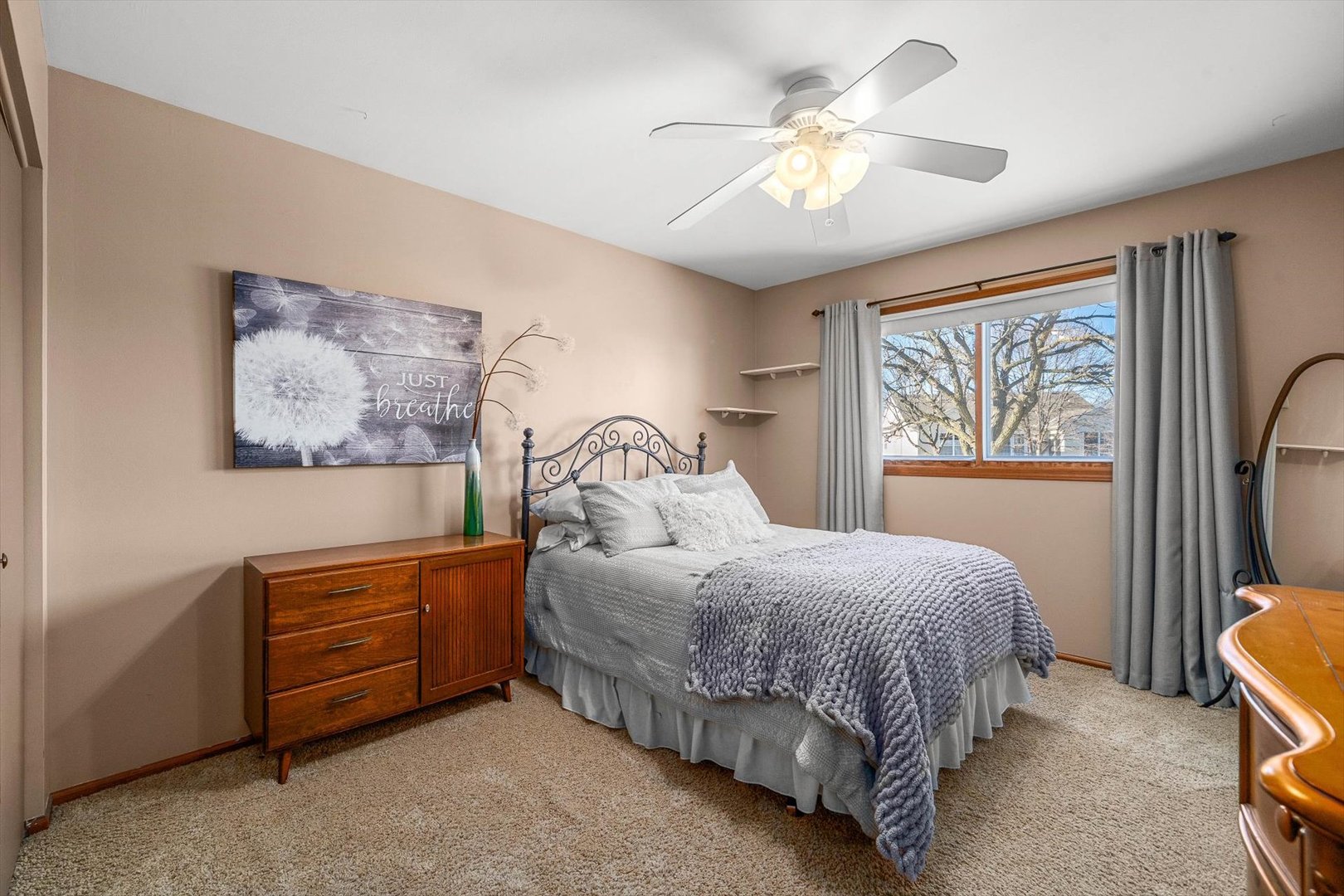 431 Badger Lane Oswego, IL 60543 - Photo 16 of 19 a bedroom with a bed and a chandelier