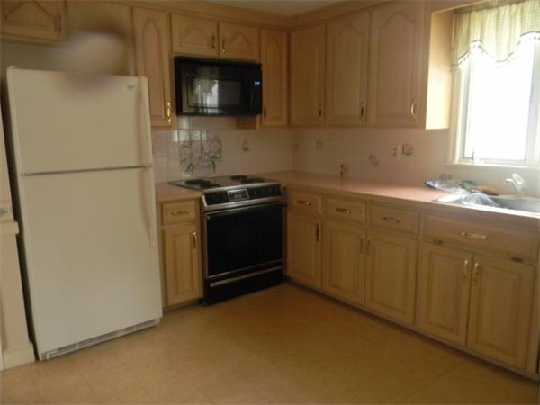 378 Hayward Mill Road Concord, MA 01742 - Photo 2 of 15 a kitchen with stainless steel appliances granite countertop a stove a sink and a refrigerator