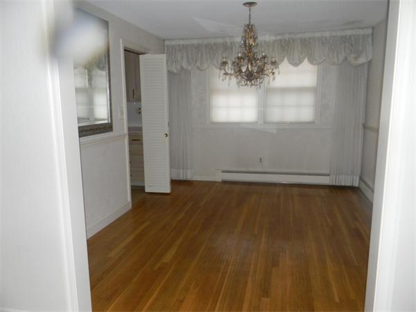378 Hayward Mill Road Concord, MA 01742 - Photo 5 of 15 a view of a room with wooden floor and chandelier
