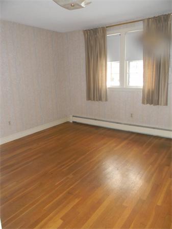 378 Hayward Mill Road Concord, MA 01742 - Photo 6 of 15 an empty room with wooden floor and windows