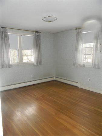 378 Hayward Mill Road Concord, MA 01742 - Photo 7 of 15 an empty room with wooden floor and windows