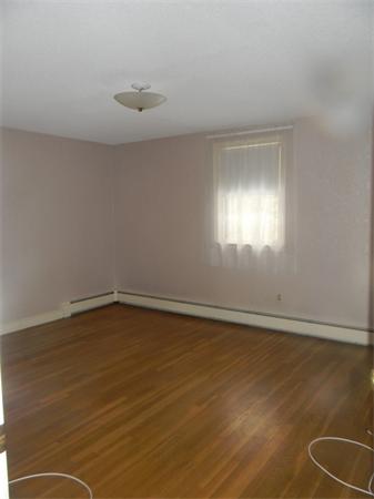 378 Hayward Mill Road Concord, MA 01742 - Photo 8 of 15 a view of an empty room with wooden floor and a window