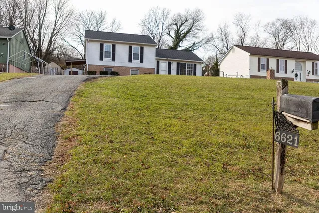 a front view of a house with yard