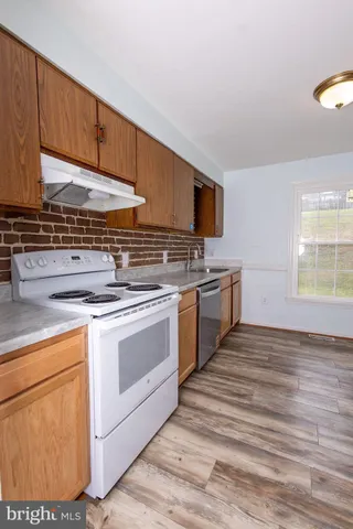 a kitchen with a stove and a microwave