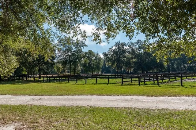 a building outdoor space with patio furniture and potted plants