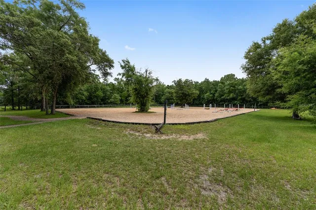 a view of a swimming pool with a yard