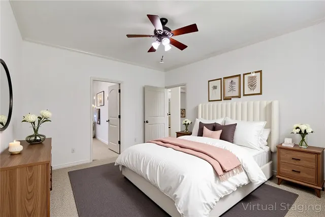 a bedroom with bed and a chandelier