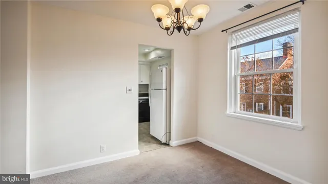 a view of a kitchen cabinets and a stove